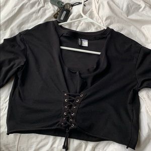 NWOT black lace up cutout tee